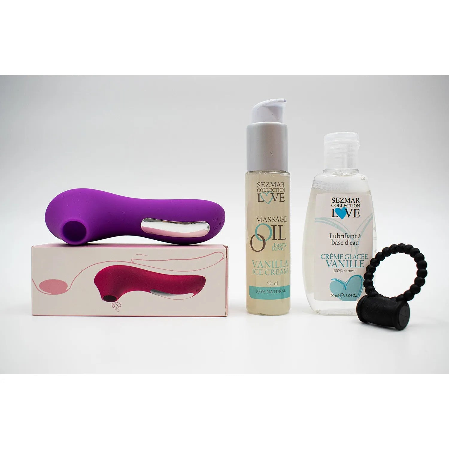Coffret estival couples: huile massage vanille, lubrifiant, stimulateur silicone violet, anneau vibrant noir.