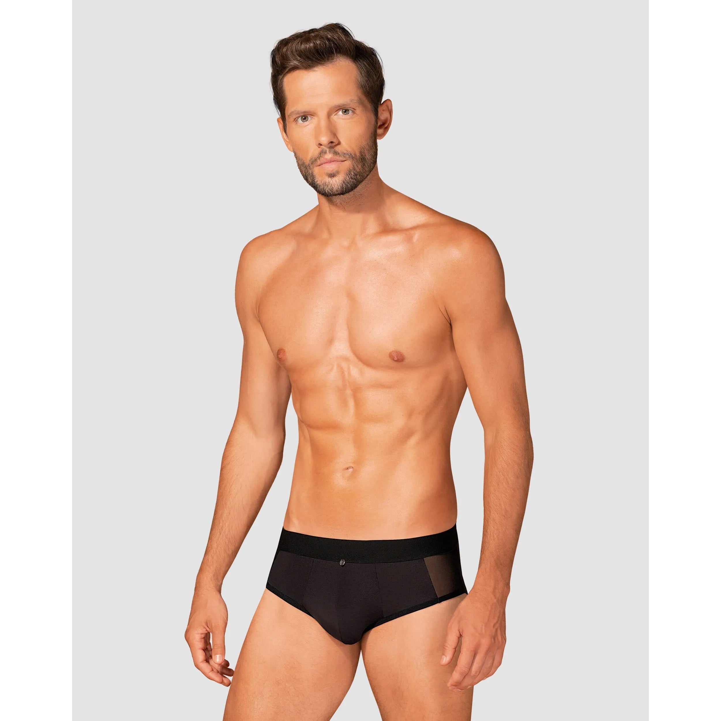 Slip homme noir Boldero, coupe classique, maille transparente, pendentif argent, élégant et confortable.