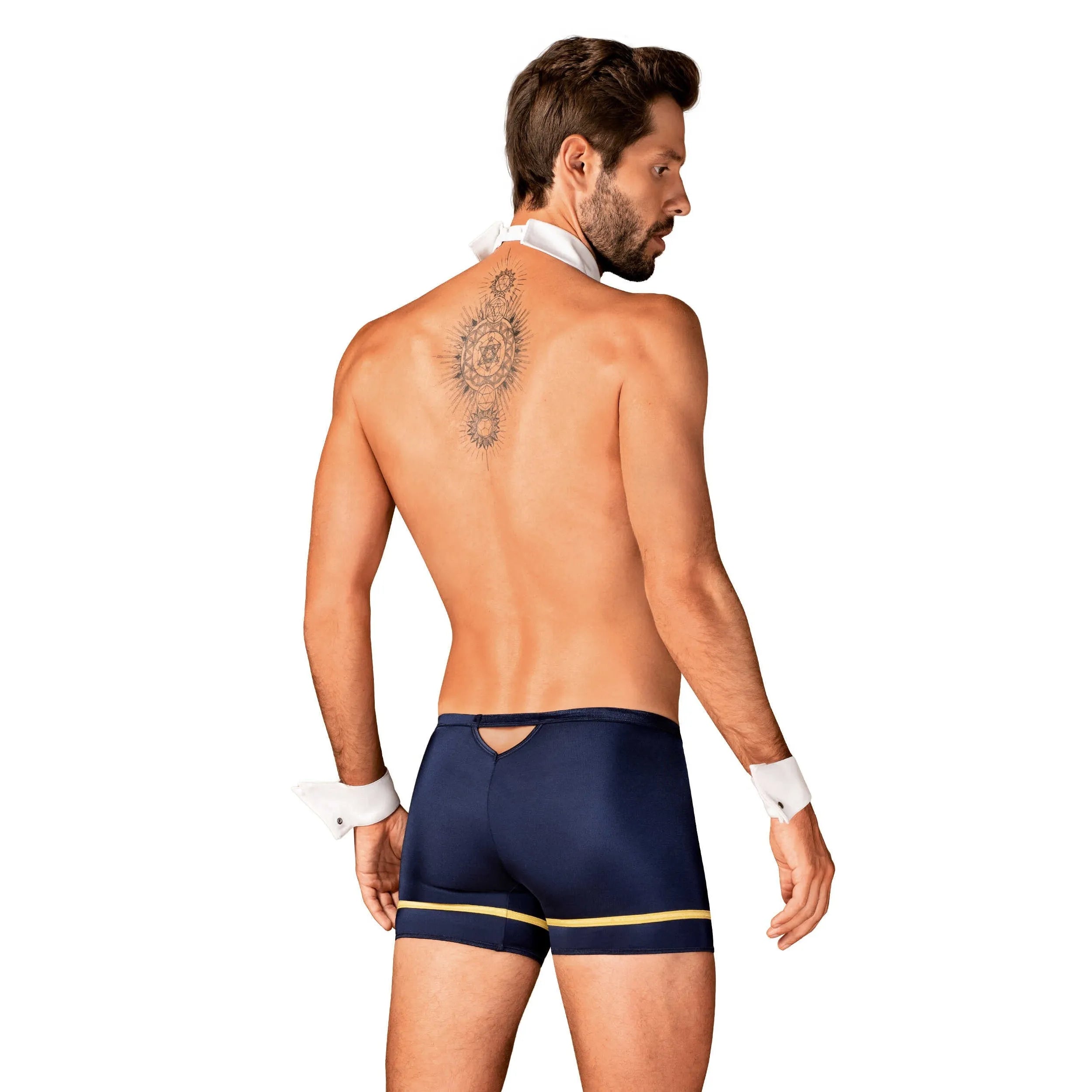 Costume pilote homme sexy bleu doré, caleçon ajusté, cravate blanche, lunettes, style glamour et séduisant.