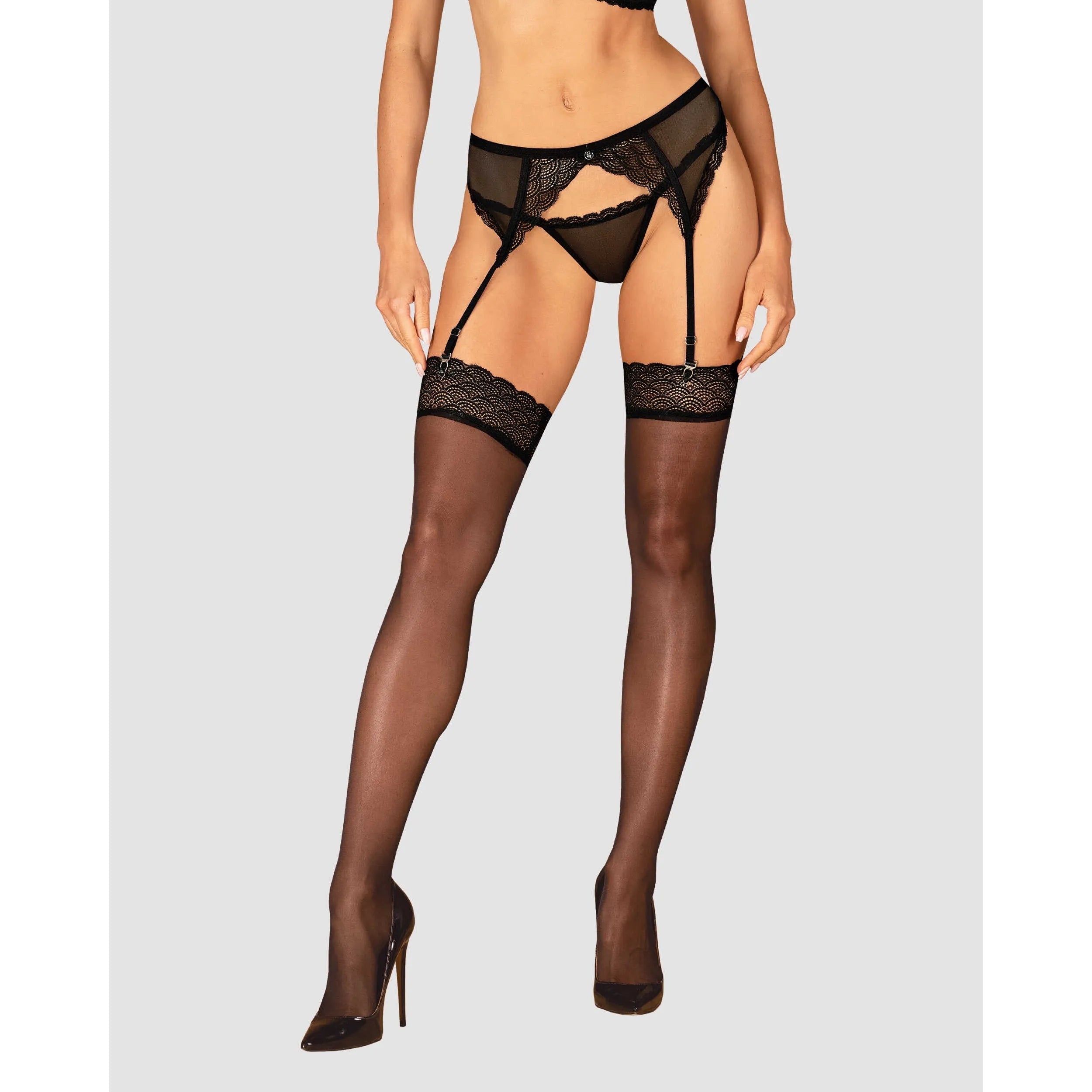 Bas dentelle noire amincissante avec finition géométrique, confort extensible, élégant pour bureau et soirée.