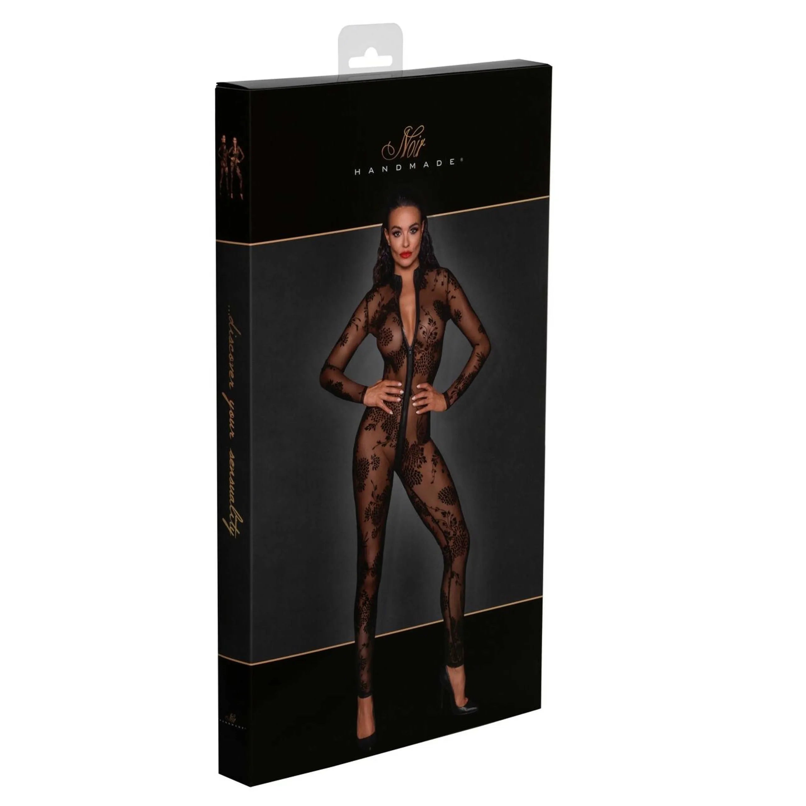 Combinaison noire en tulle transparent avec broderies floquées, fermeture éclair trois voies, élégance et sensualité.