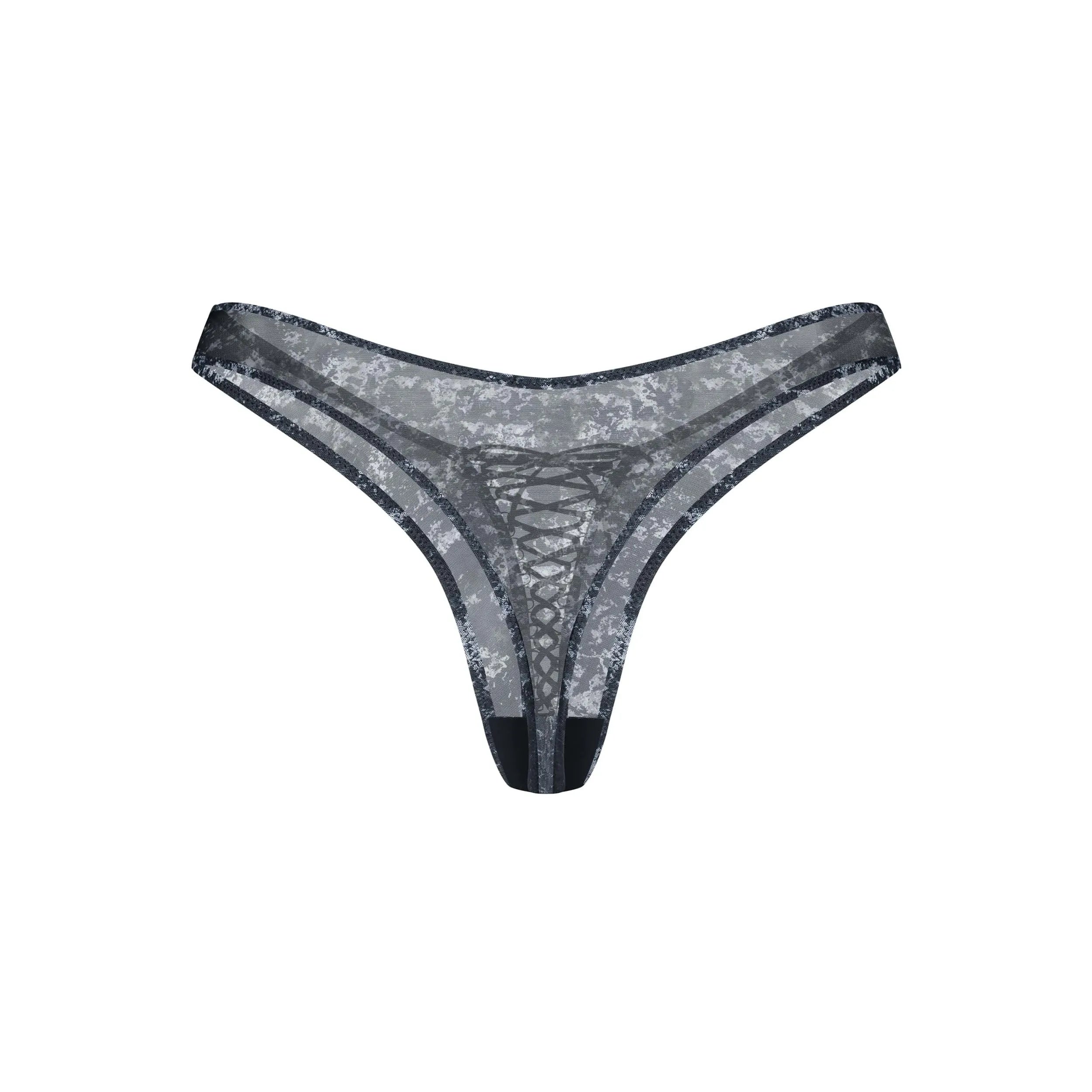 String Corrosis noir transparent, motif original, cravate devant, détail décoratif, élégant et confortable.