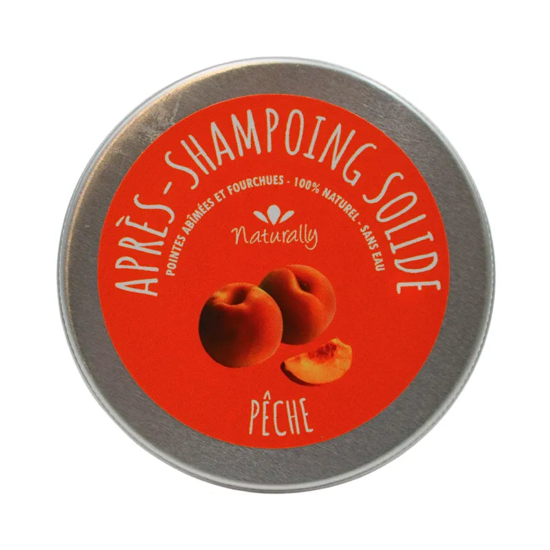 Après-shampoing solide naturel mangue pêche, boîte ronde orange, brillance et douceur pour cheveux abîmés.