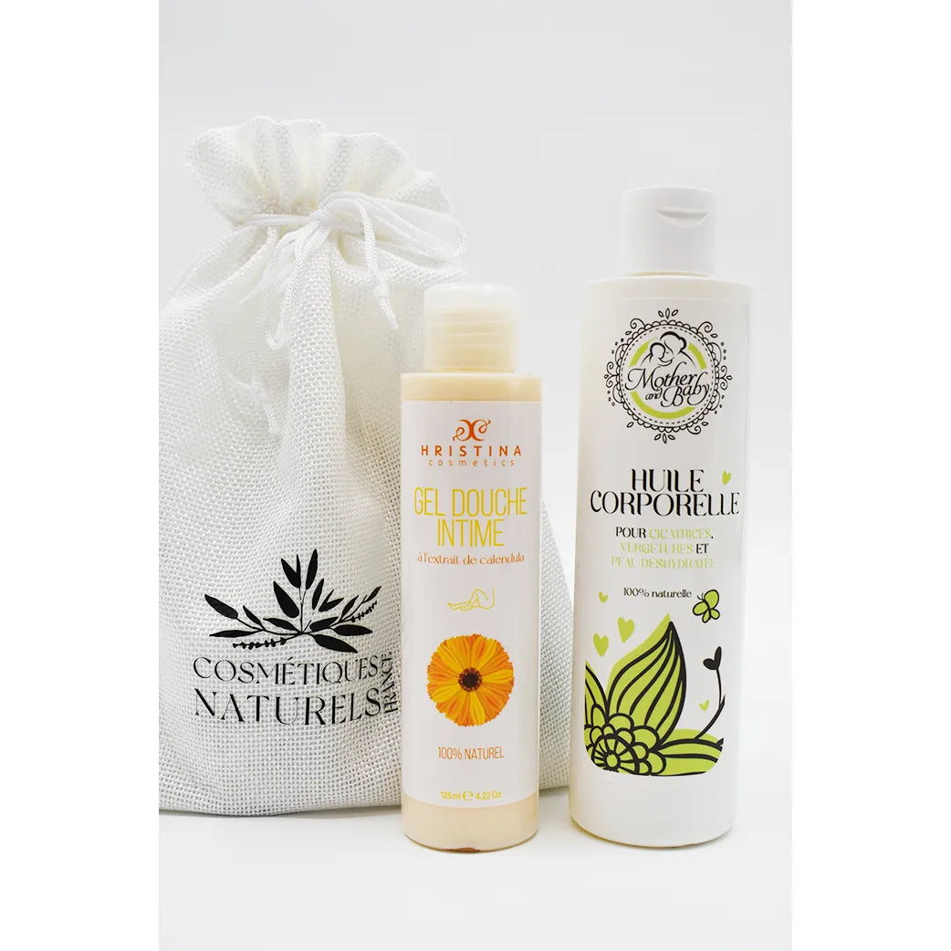 Coffret maternité avec huile vergetures et gel douche intime calendula, flacons blancs et sac en tissu naturel.