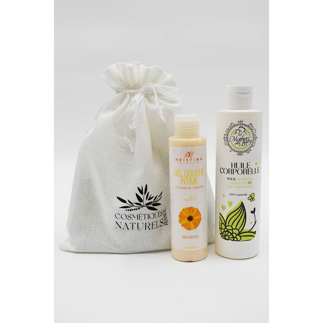 Coffret maternité avec huile vergetures et gel douche intime calendula, flacons blancs et beige, sac en tissu naturel.