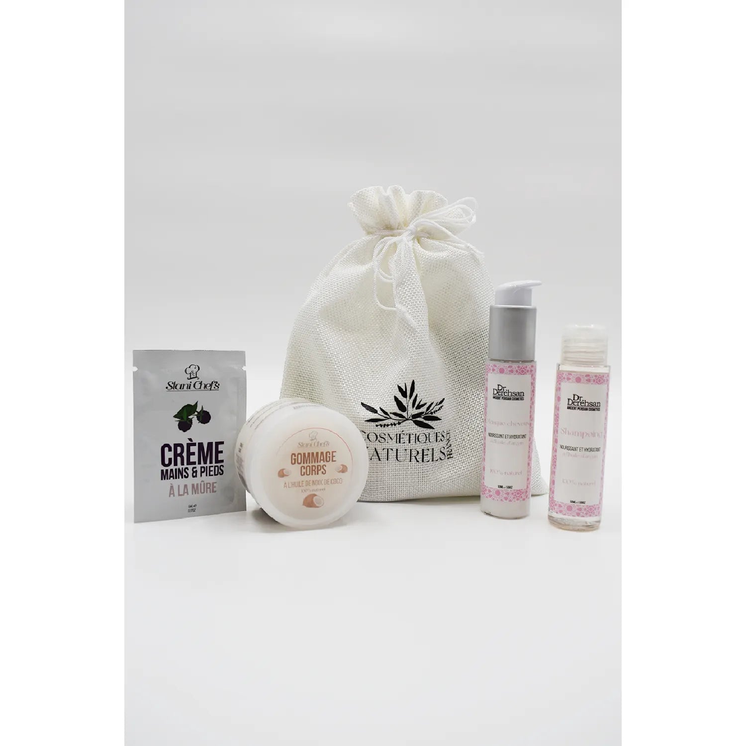 Coffret soins naturels cheveux secs: huile d'argan, gommage coco, flacons et sachet blanc, produits beauté bio.