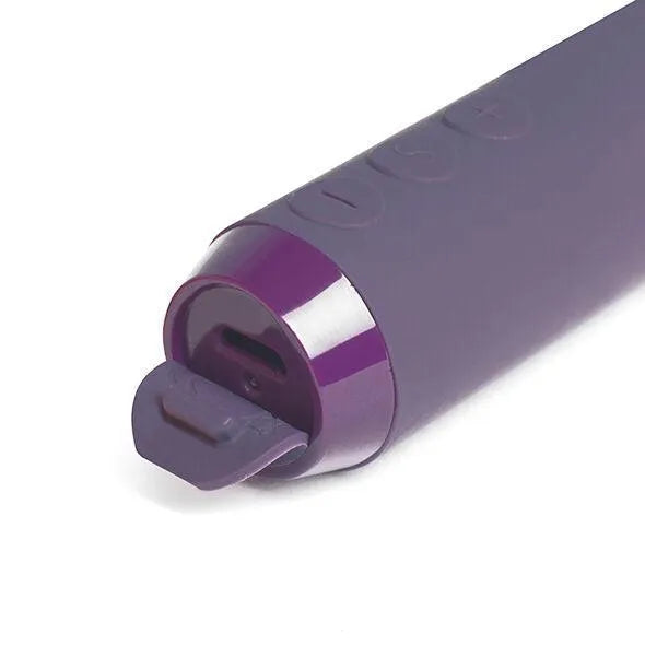 Vibromasseur violet ergonomique en silicone, rechargeable, boutons intuitifs, design compact et discret, étanche.