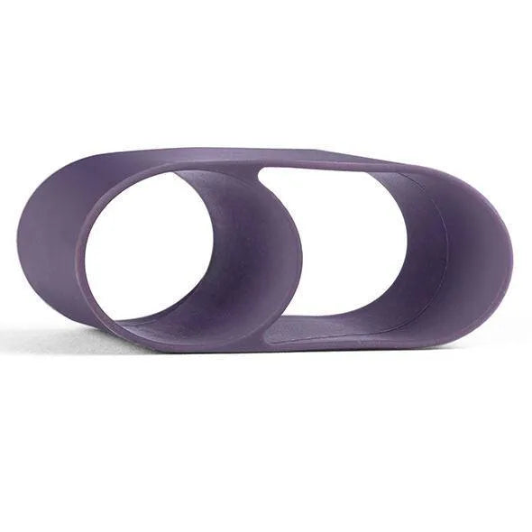 Accessoire vibromasseur mains libres violet, design ergonomique en silicone, forme ovale, compact et discret.