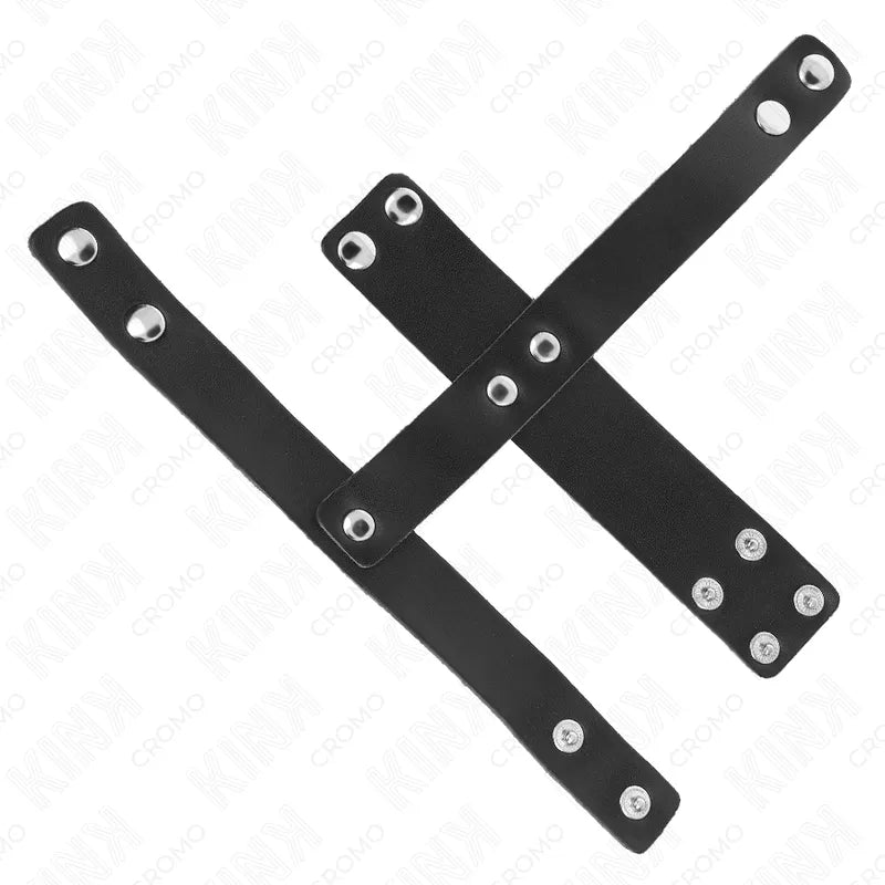 Anneaux péniens cuir végan noirs ajustables avec boutons-pression, design ergonomique et élégant pour confort et plaisir.