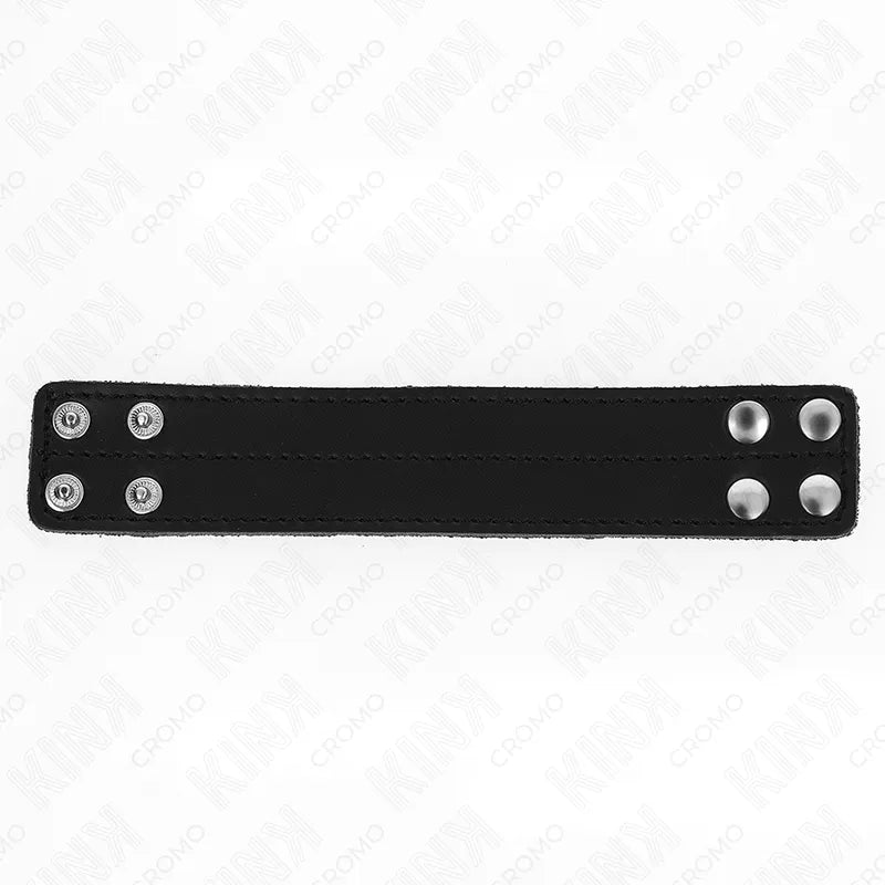 Anneau pénien cuir noir ajustable, boutons pression, design sophistiqué pour plaisir BDSM et confort optimal.