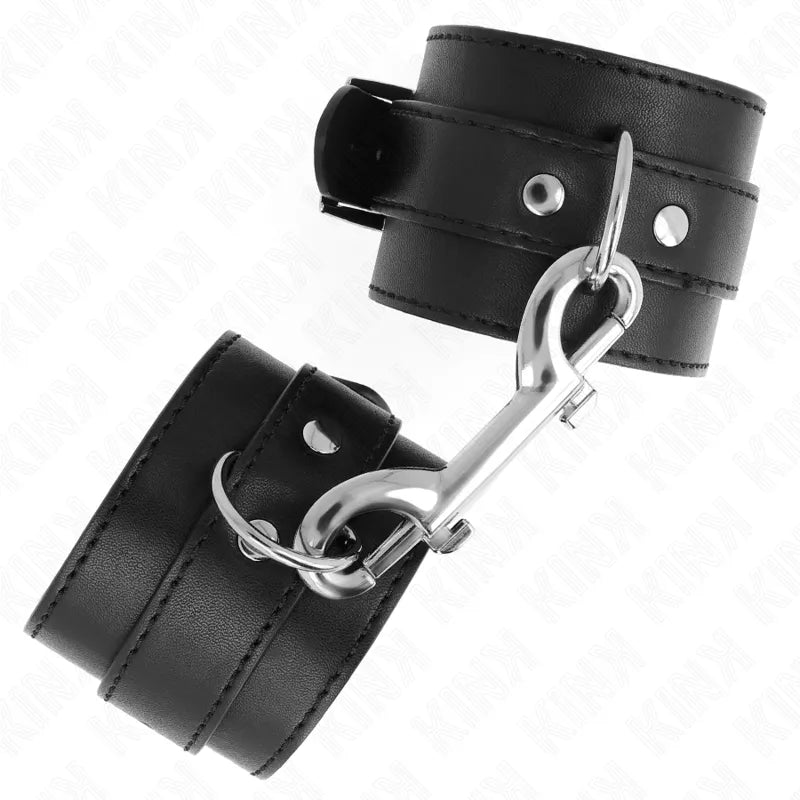 Bandes poignet BDSM cuir végétalien noir, boucles métalliques robustes, rembourrage confortable, finitions artisanales.