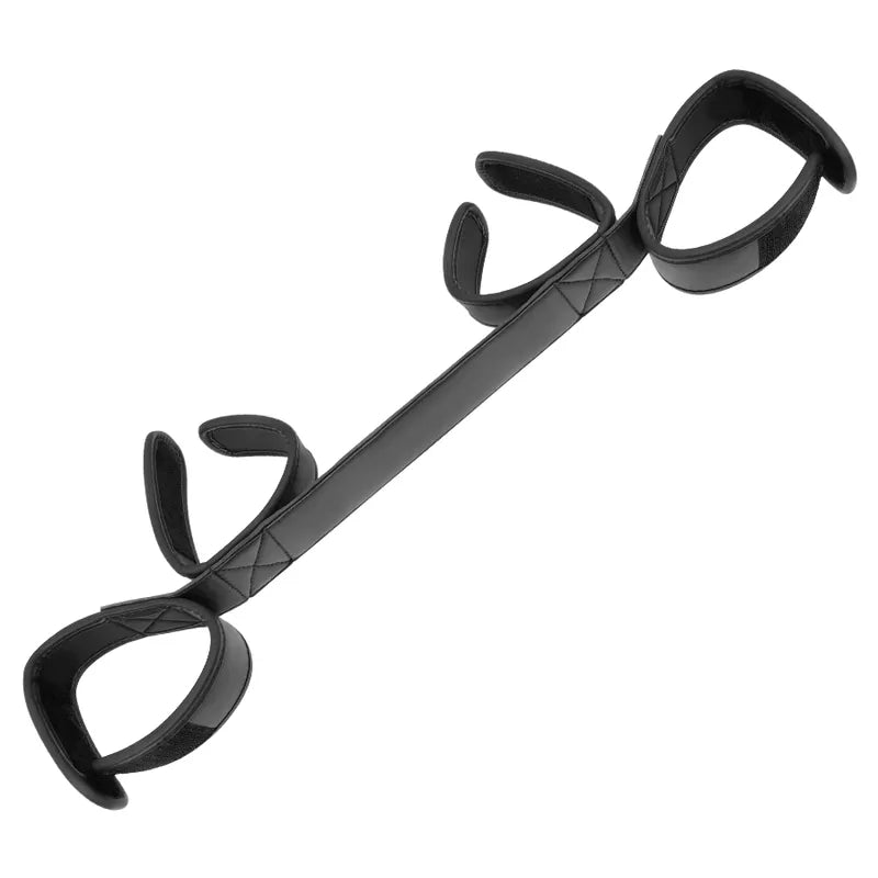 Barre d'écartement BDSM noire en néoprène et cuir vegan, rembourrée, avec attaches velcro pour poignets et chevilles.