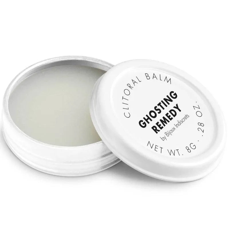 Baume clitoridien chauffant parfumé, pot blanc compact, texture soyeuse, pour peau sensible, expérience sensorielle intime.