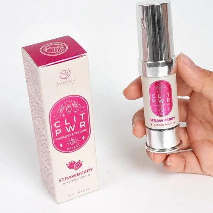 Baume stimulant clitoris fraise, flacon argenté 15ml, packaging rose, intensité chauffante et vibrante, absorption rapide.