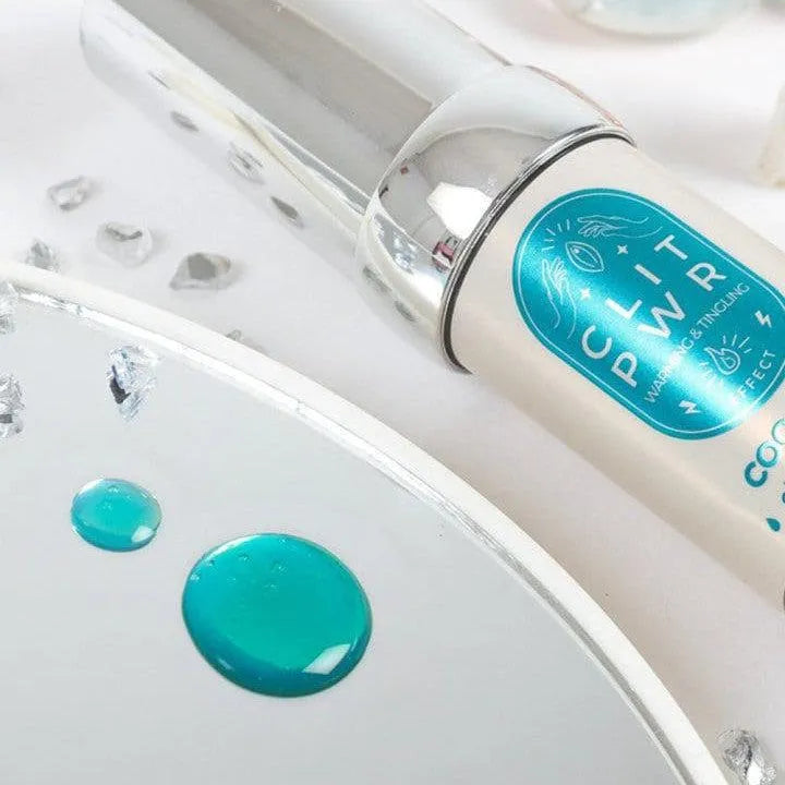 Baume stimulant clitoridien coco chauffant, flacon 15ml, design moderne, étiquette bleue, fond blanc.
