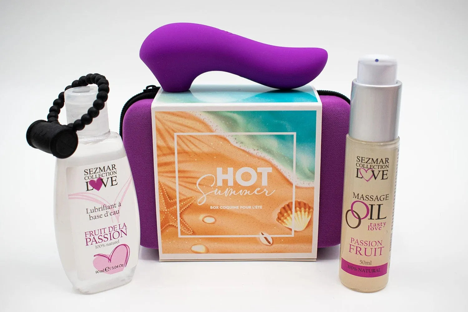 Coffret été passion: stimulateur violet, anneau vibrant, huile massage, lubrifiant fruité, trousse rigide colorée.