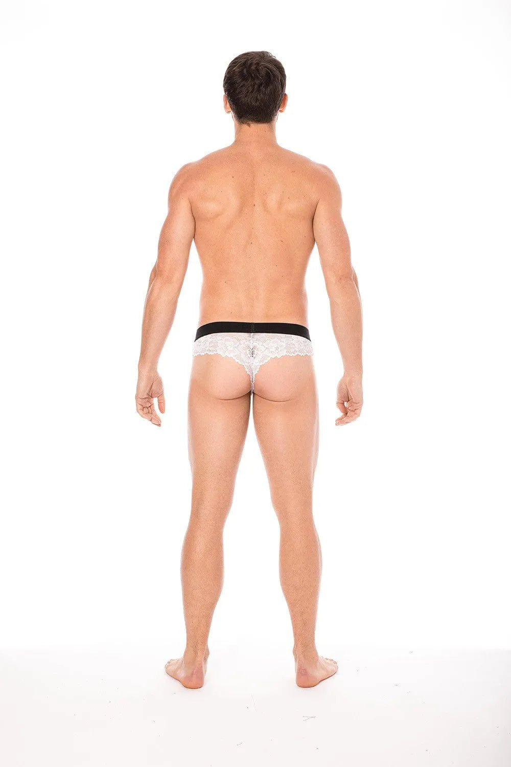 Boxer string homme en dentelle blanche florale, poche opaque, maintien affinant, élégant et sensuel, dos visible.