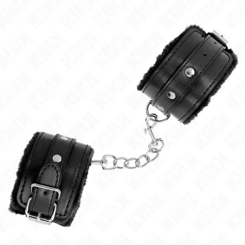 Bracelet BDSM en cuir noir, robuste et élégant, avec chaîne métallique, pour confort et sécurité dans l'univers intime.