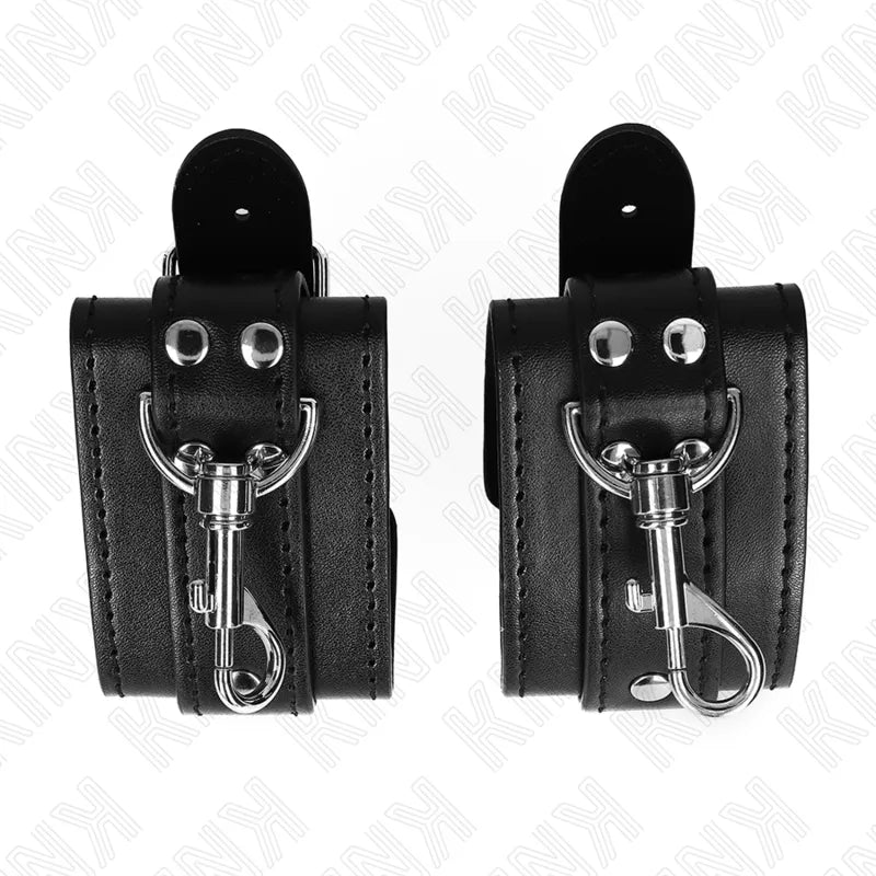 Bracelets BDSM en cuir noir avec boucles métalliques robustes et rembourrage, élégance et sécurité pour expériences intimes.