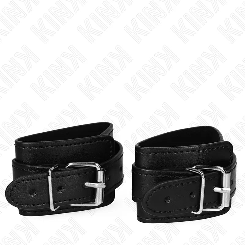 Bracelets BDSM en cuir noir avec boucles métalliques robustes, rembourrage intérieur, élégance et sécurité.
