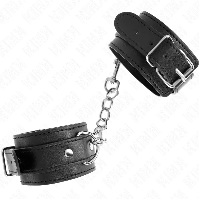 Bracelets BDSM en cuir noir, rembourrés, avec boucles et anneaux métalliques, chaîne de liaison robuste et élégante.
