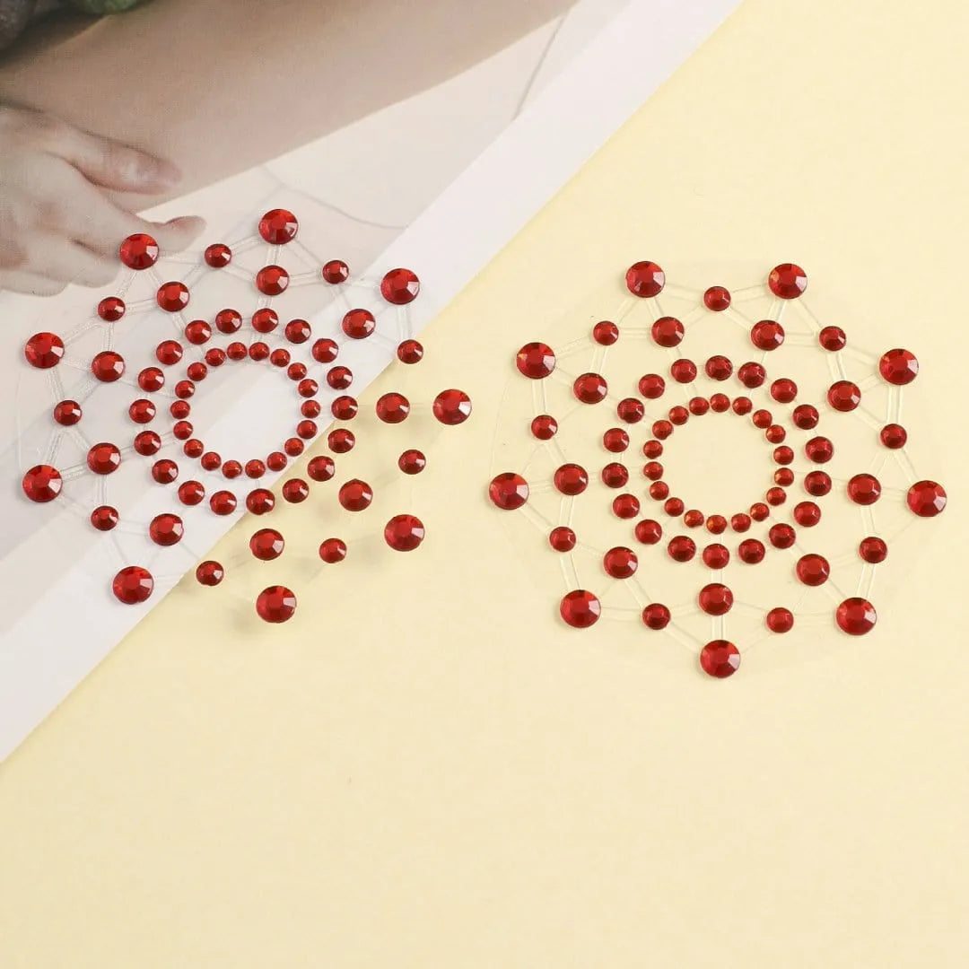 Cache-tétons réutilisables en strass rouges brillants, forme circulaire élégante, hypoallergéniques et glamour.