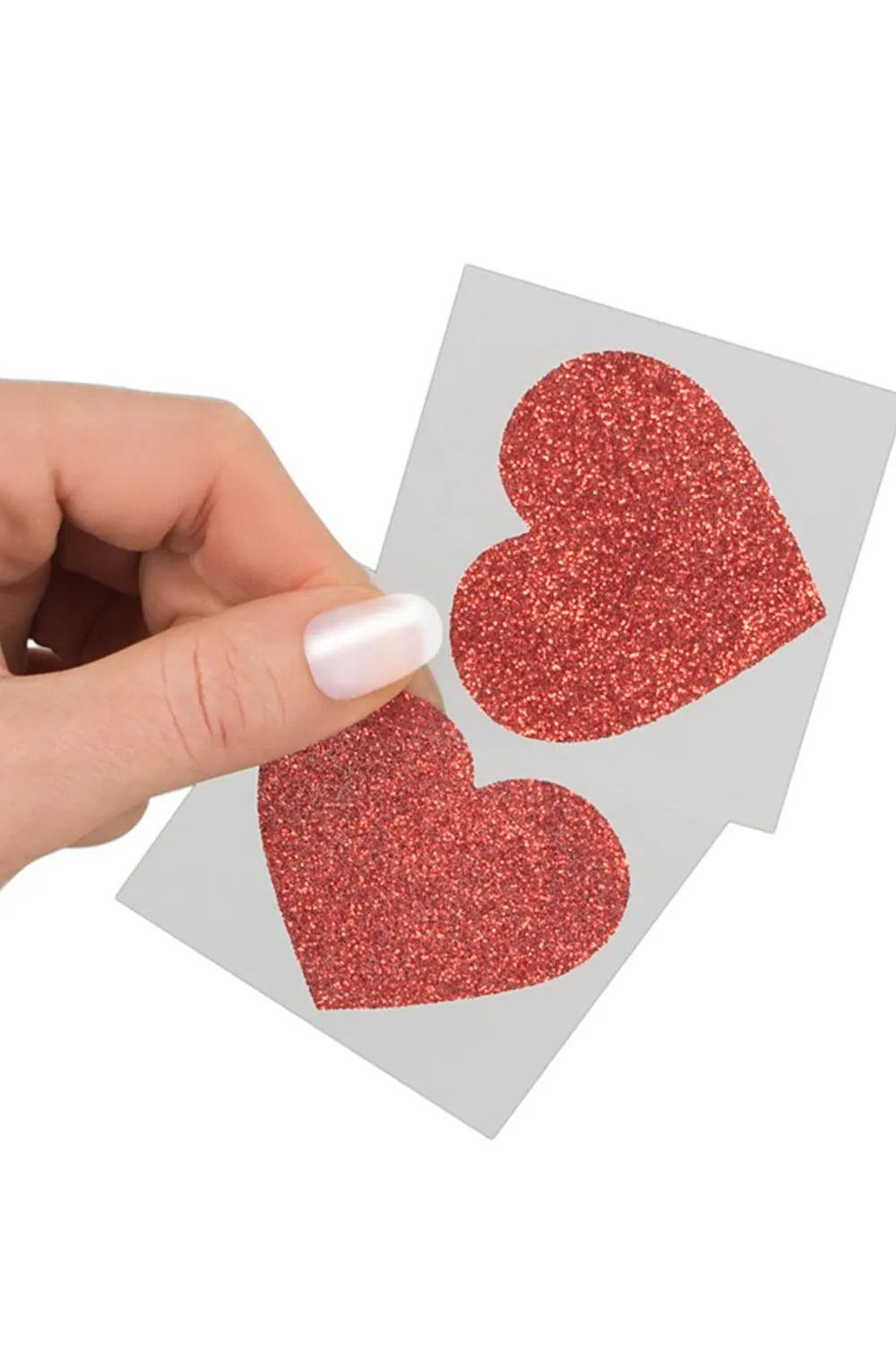 Cache-tétons rouges en forme de cœur scintillant, adhésifs et confortables, parfaits pour une touche glamour et romantique.