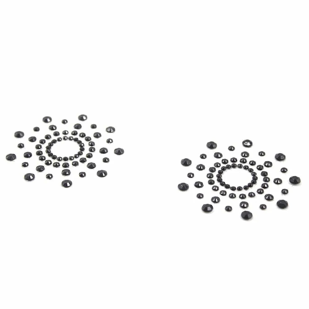 Caches tétons adhésifs noirs en strass acrylique, forme circulaire, glamour et discrets pour sublimer la poitrine.