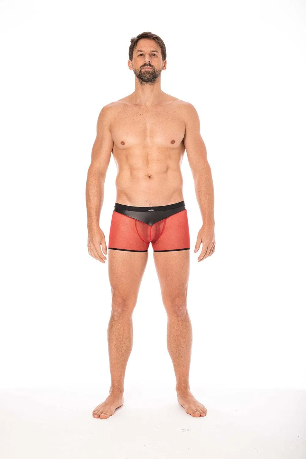 Caleçon transparent résille rouge, simili cuir brillant, poche frontale, confort extensible, polyester élasthanne.