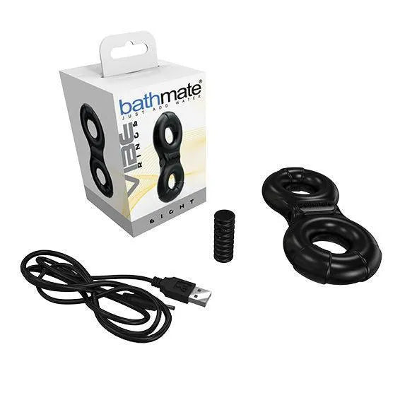 Cockring noir en Elastomex, forme ergonomique, avec câble USB et emballage, pour plaisir intensifié et confort optimal.