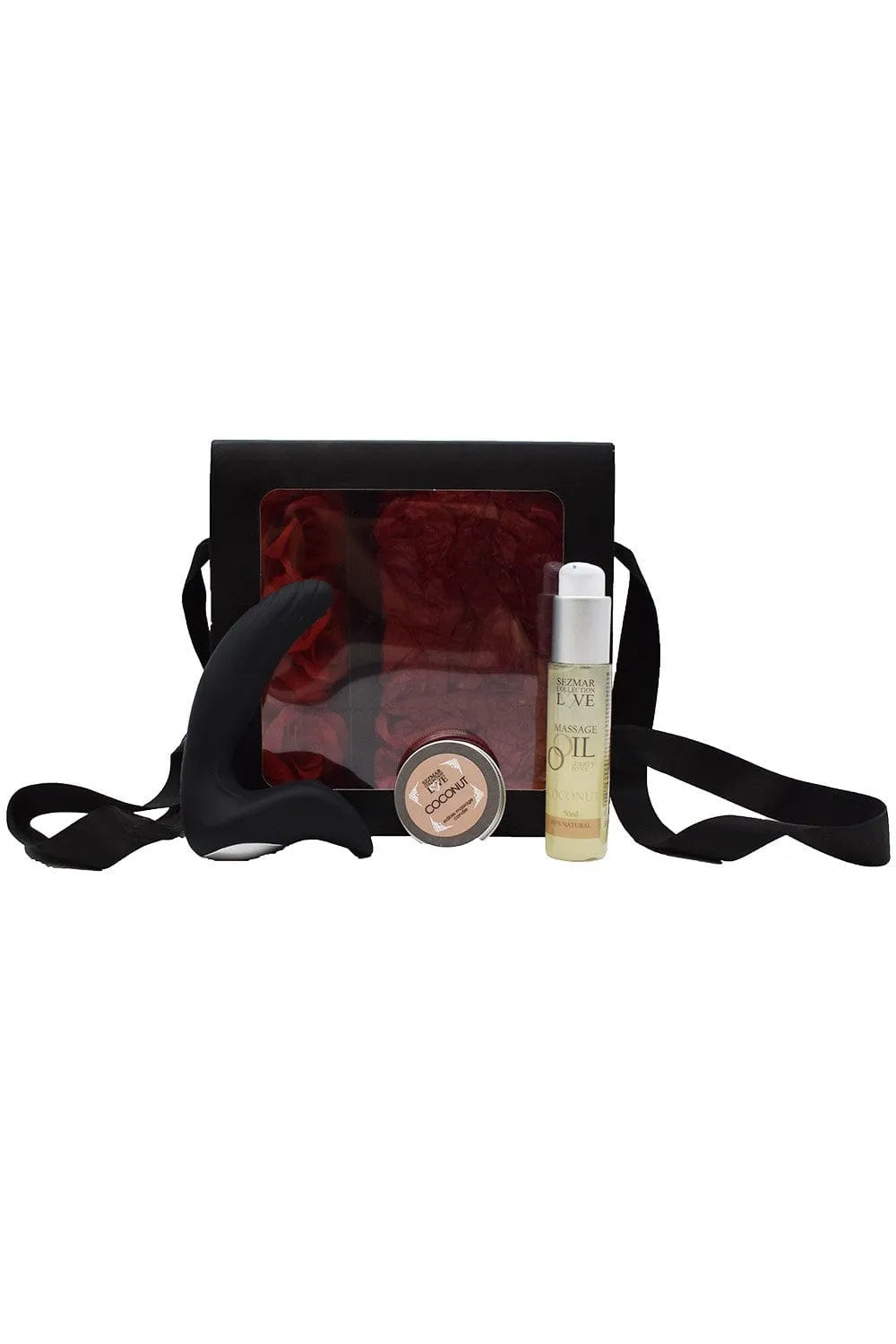 Coffret coquin homme Noël avec huile coco, bougie massage, stimulateur prostate noir, roses rouges en arrière-plan.
