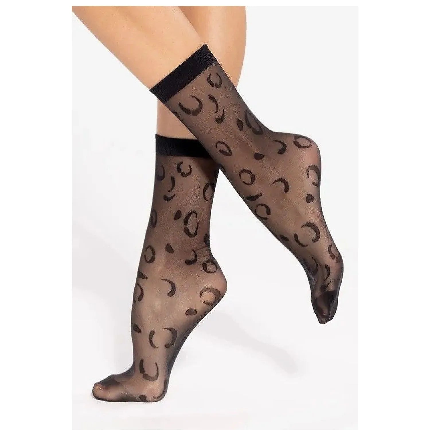 Chaussettes hautes noires translucides motif léopard, mi-mollet, bord côtelé, élégantes et sensuelles pour femmes.