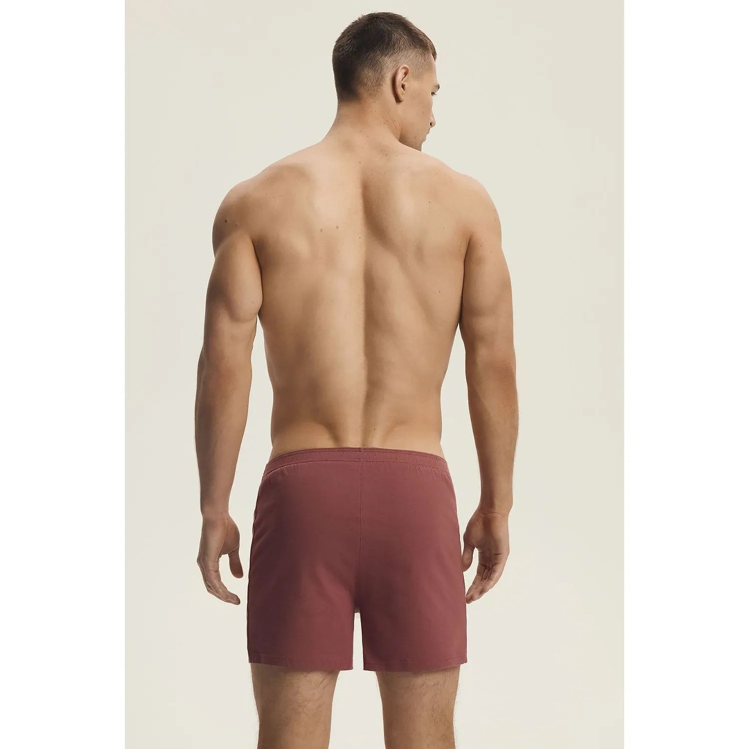 Boxer homme bordeaux ample en coton synthétique, ceinture élastique, boutons frontaux, confort et élégance.