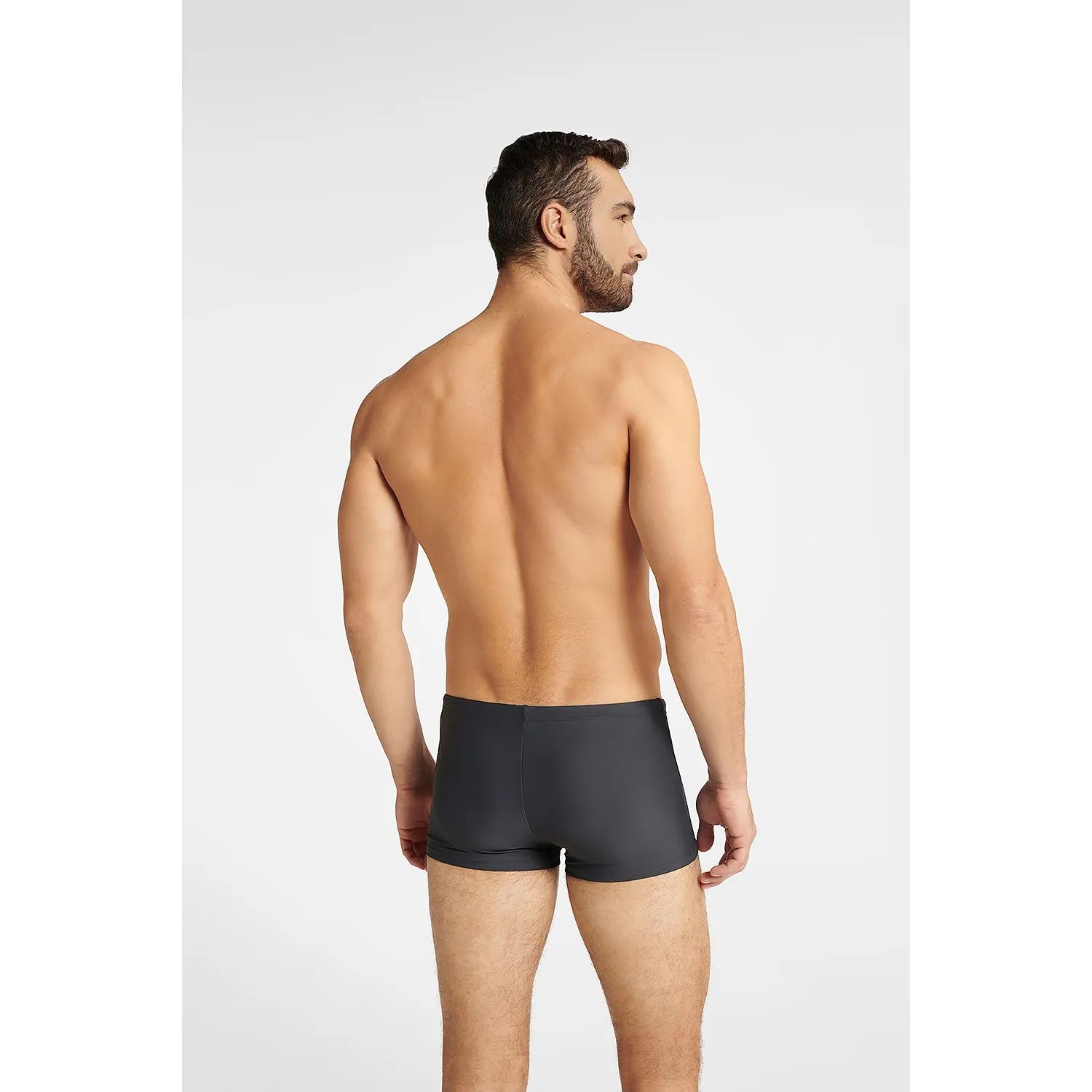 Boxer de bain homme noir ajusté, ceinture élastique, coupe classique, confort et style pour activités aquatiques.