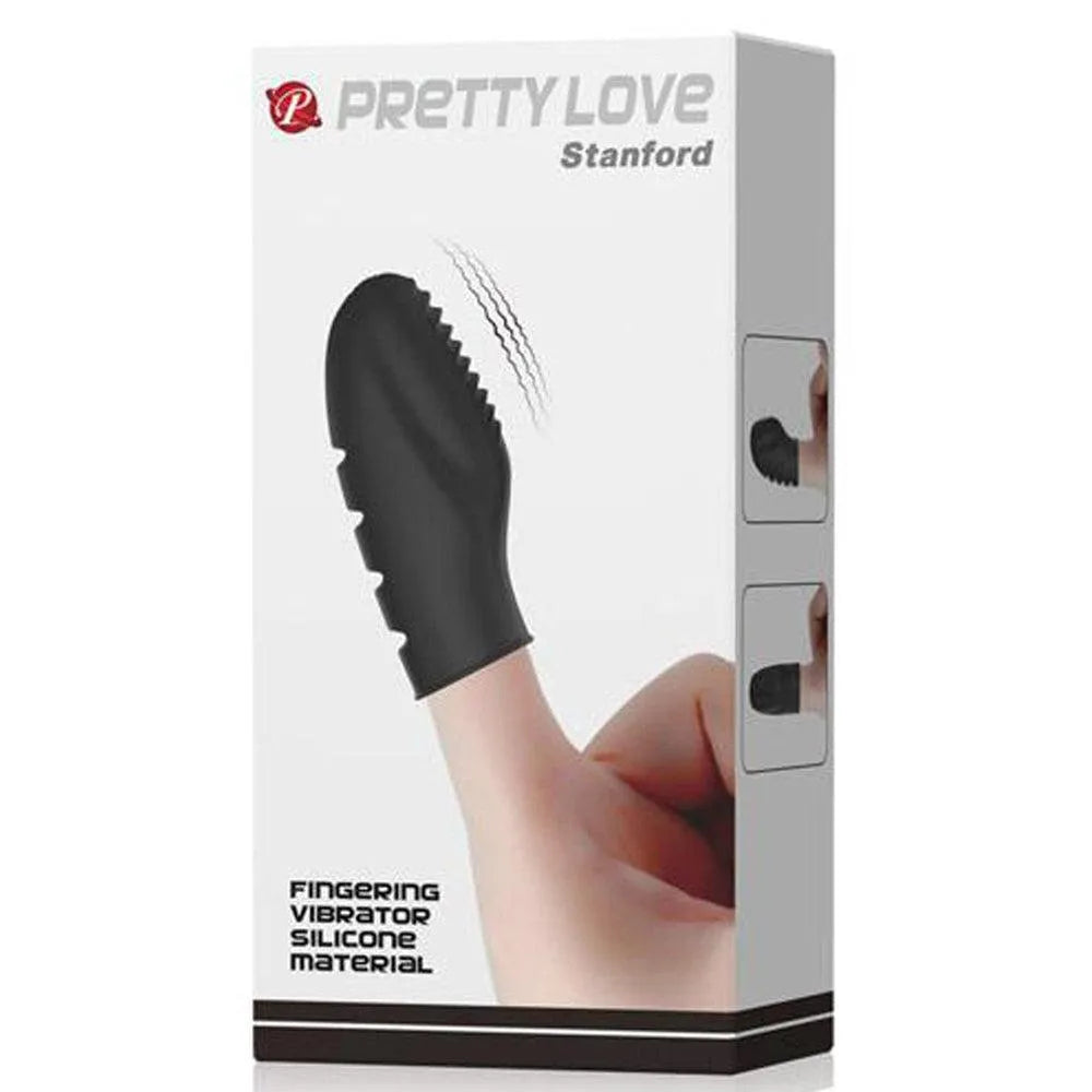 Doigt vibrant silicone noir texturé, picots, ergonomique, compact, sur emballage blanc avec main tenant le produit.