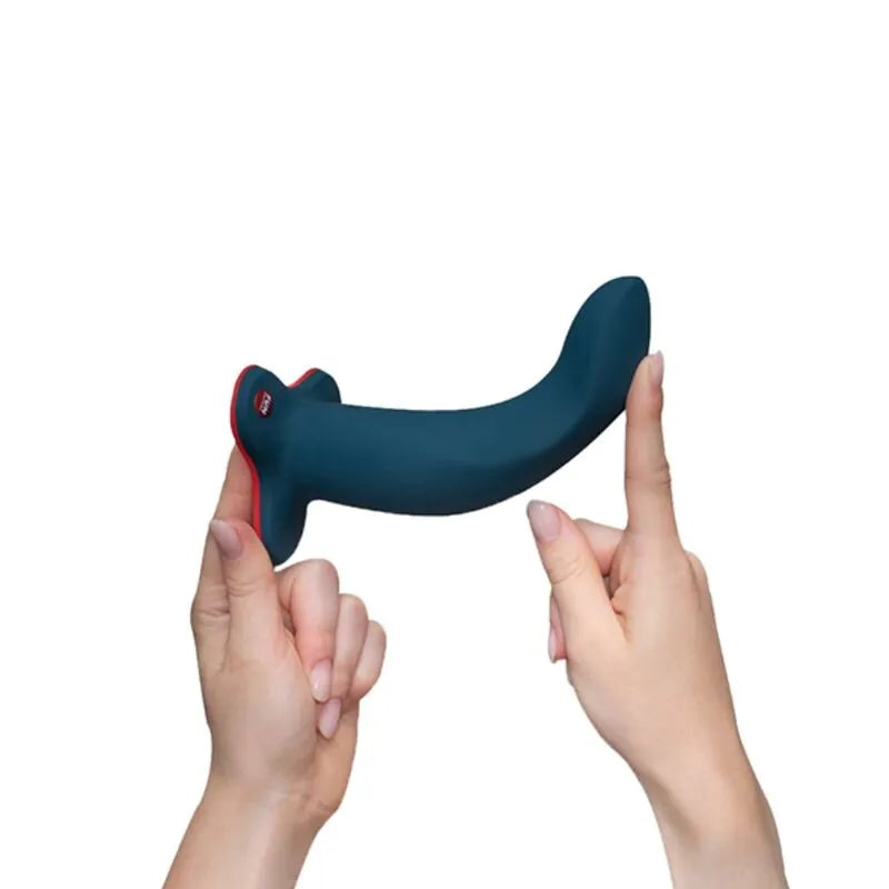 Gode pliable bleu foncé, articulé, pointe effilée, ergonomique, tenu par deux mains, fond blanc.