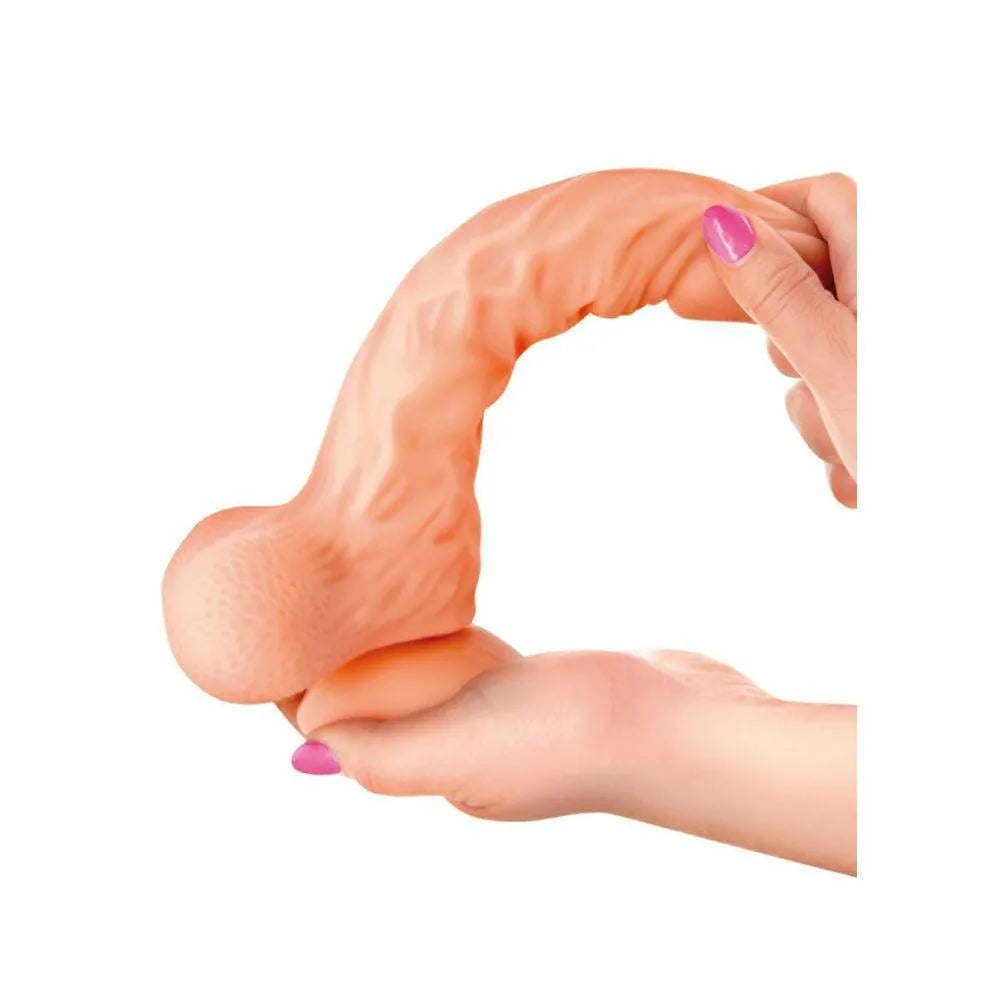 Godemichet réaliste en silicone souple, couleur chair, texture veinée, testicules avec billes, ventouse puissante.