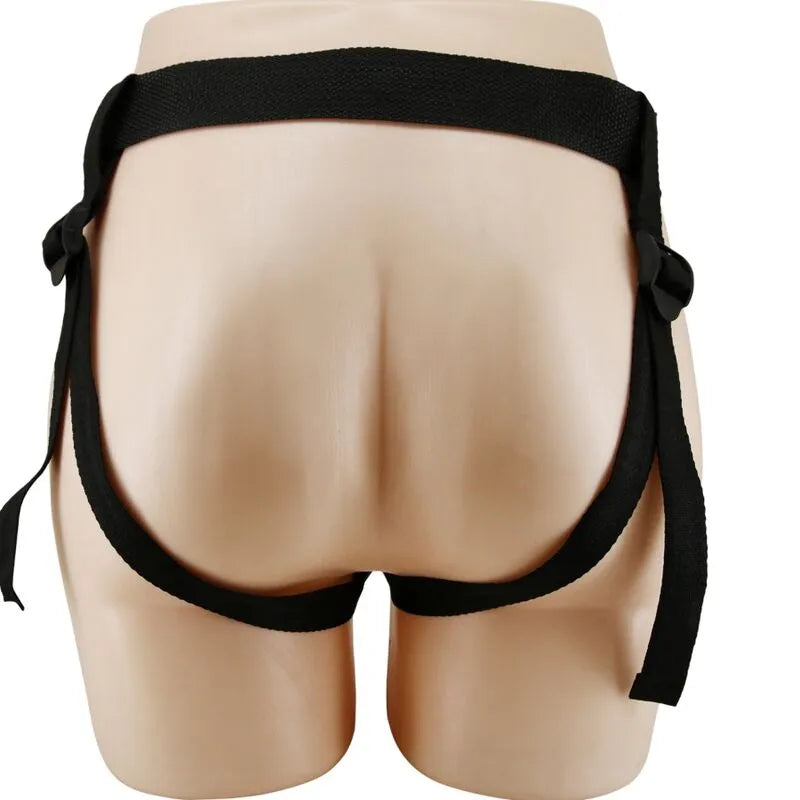 Harnais noir avec gode creux veinée, bretelles ajustables, en TPR doux, pour confort et ajustement morphologique optimal.