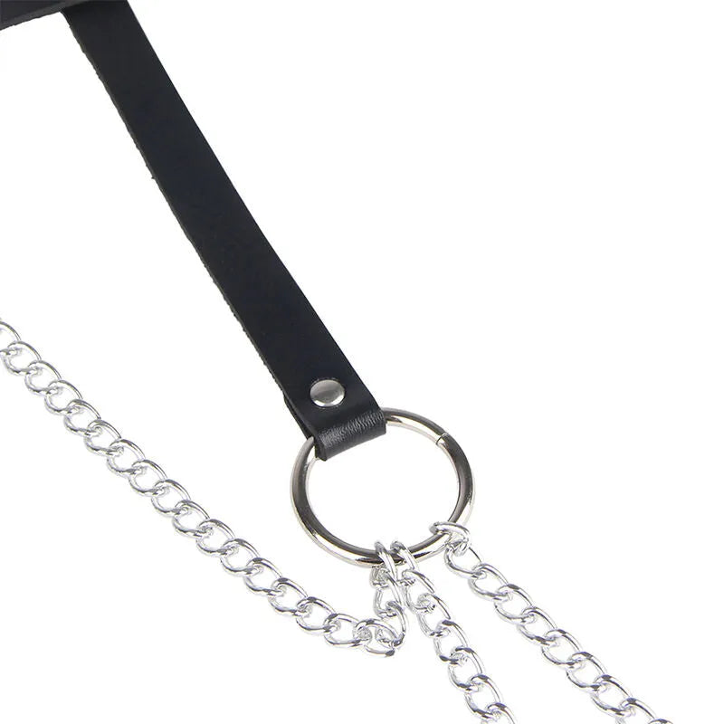 Ceinture cuir noir Subblime avec chaînes métalliques et anneaux, élégante et audacieuse pour sublimer la silhouette.