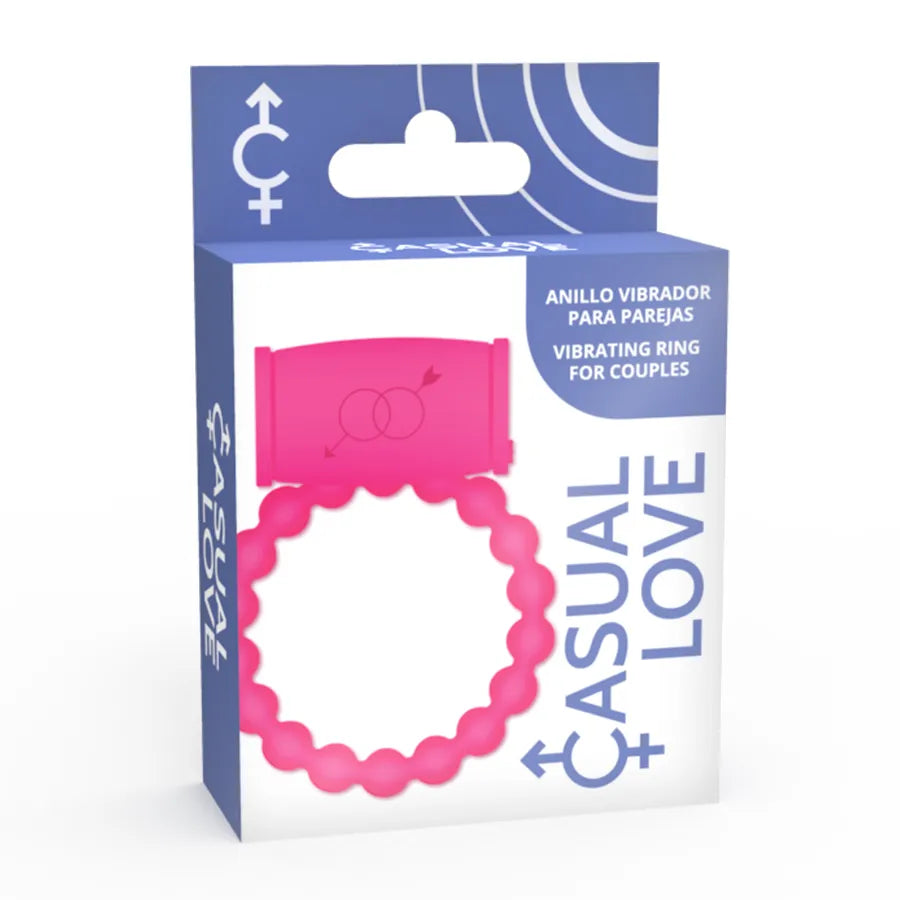 Anneau vibrant rose en silicone flexible, hypoallergénique, sur emballage bleu, pour stimulation clitoridienne et érection.