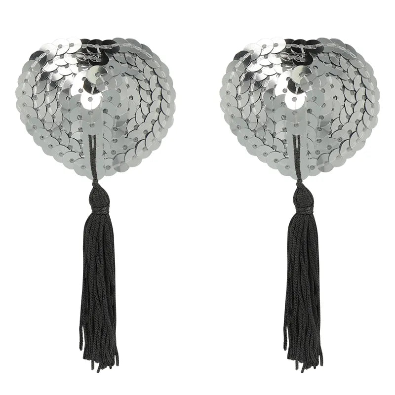 Cache-tétons argentés adhésifs avec sequins et pompons noirs, élégants et réutilisables pour un style chic et sophistiqué.