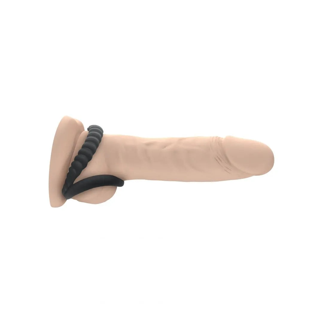 Anneau silicone noir double stimulation, cannelé, flexible, pour pénis et testicules, confort et étanchéité optimisés.
