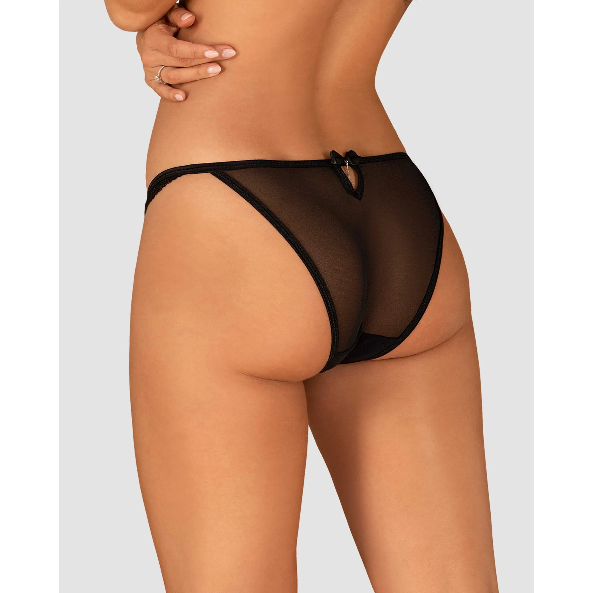 Culotte noire en dentelle transparente avec nœud décoratif, élégante et chic, vue arrière, style Ivannes.
