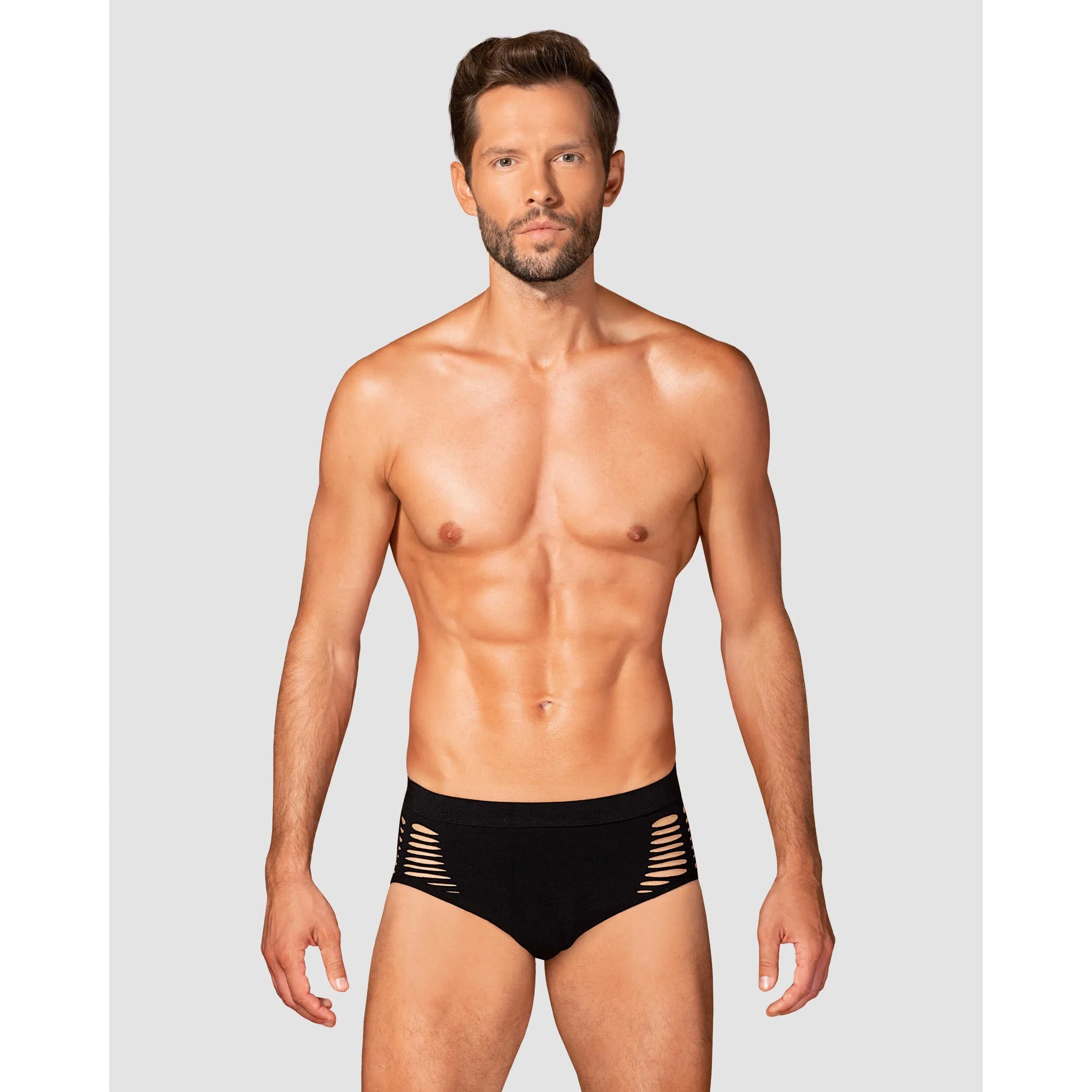 Culotte homme noire moderne avec découpes sexy, maille élastique ajustée, offrant confort et élégance sculptante.