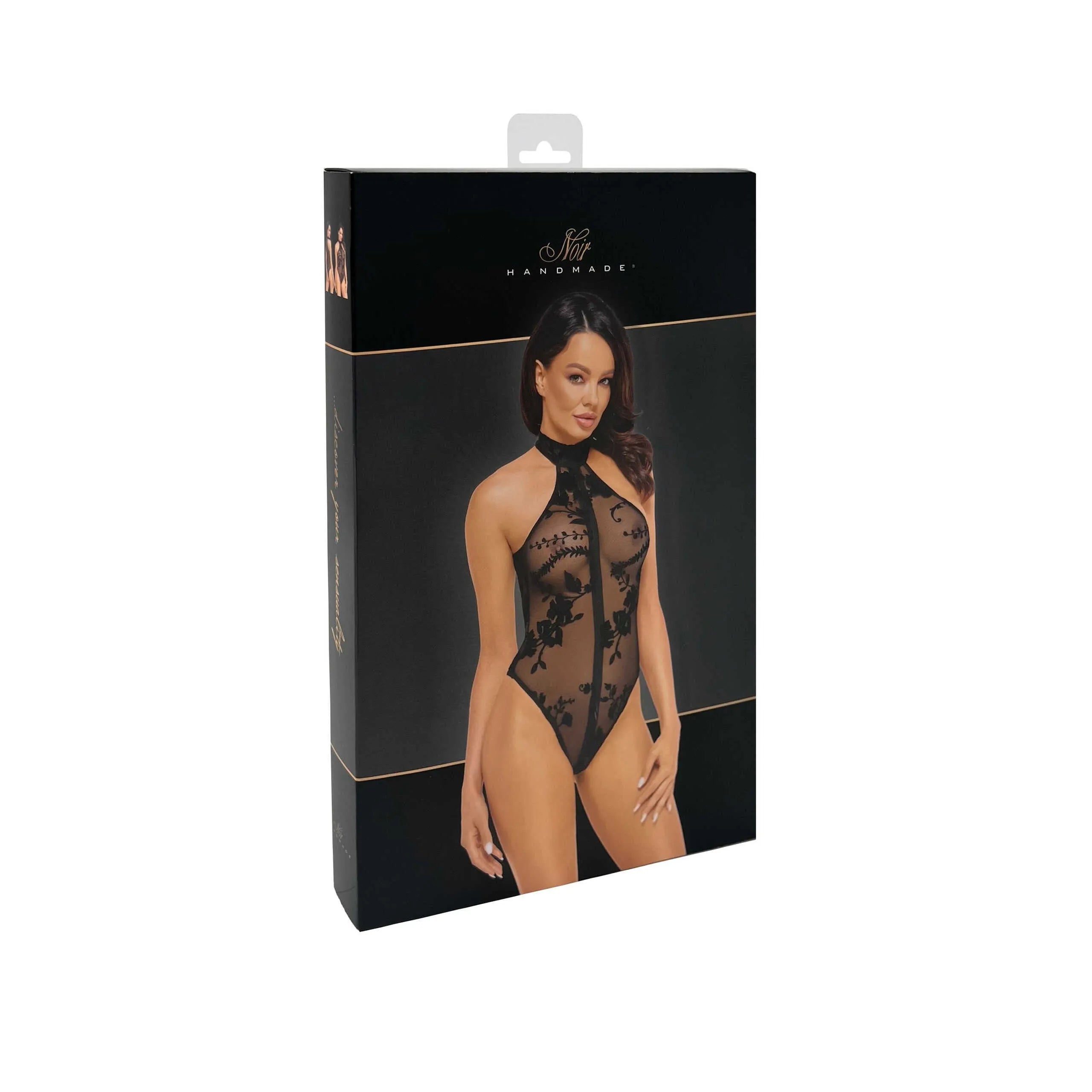 Combinaison licou noire en maille floquée fleurs sauvages, dos nu, fermeture éclair, élégante et sensuelle sur fond neutre.