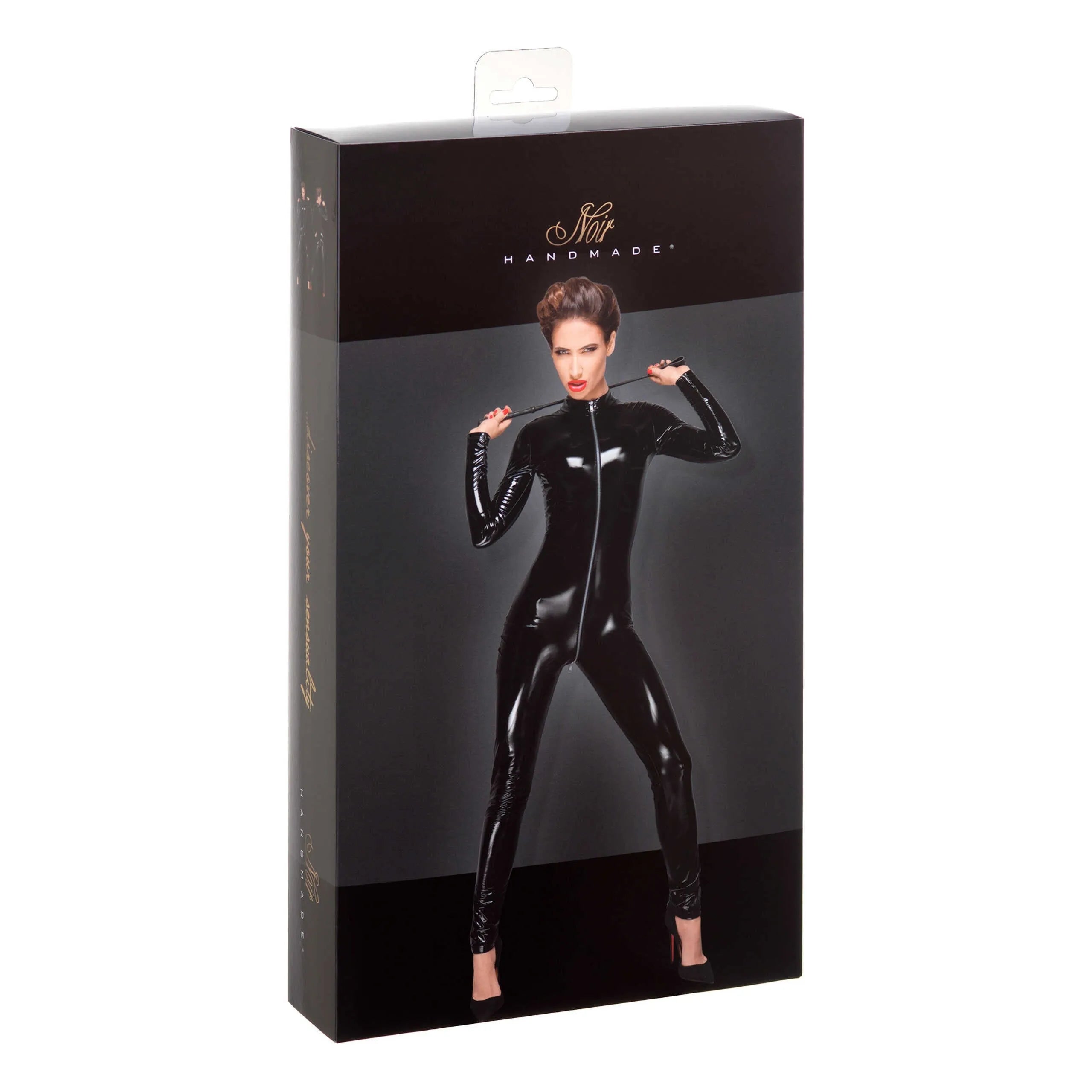 Combinaison PVC noire moulante avec fermeture éclair trois voies, manches longues, jambes zippées, sur emballage.