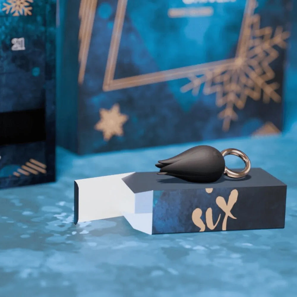 Calendrier de l'Avent érotique bleu avec sextoy noir élégant, design hivernal, surprises sensuelles de luxe.