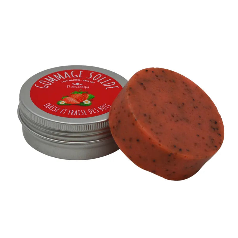 Gommage corporel solide rouge fraise avec graines, dans boîte métallique, exfoliant et hydratant au beurre de karité.
