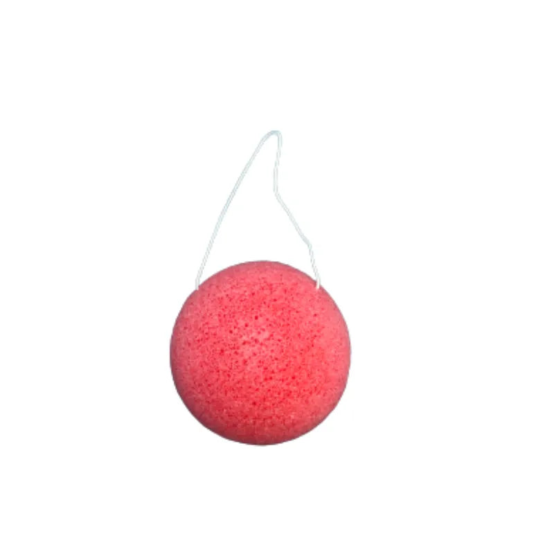 Éponge konjac rose ronde enrichie argile rouge, idéale peaux sèches sensibles, naturelle et compostable.