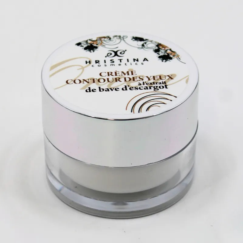 Crème contour yeux anti-âge bave escargot, pot blanc et argent, peau mature sensible, hydratation intense.